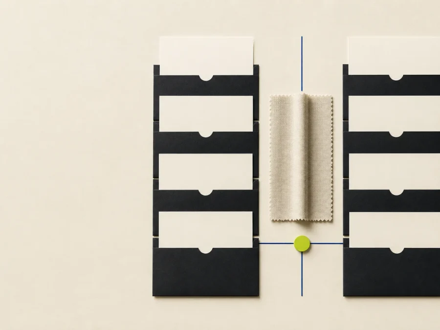 Fictional blind copy-test table with paired blank cards, dark concealed-source sleeves, cobalt dividers, and an acid-lime unblinding tab.